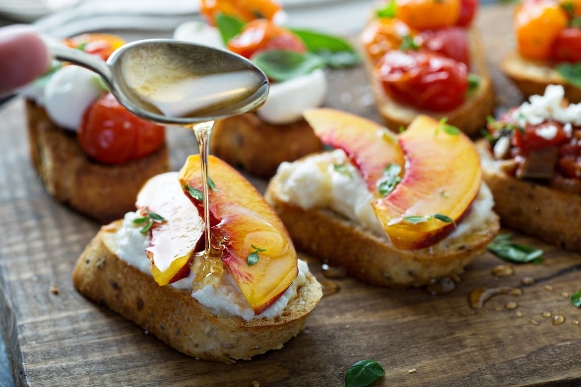 Crostini or bruschetta with ricotta and peaches